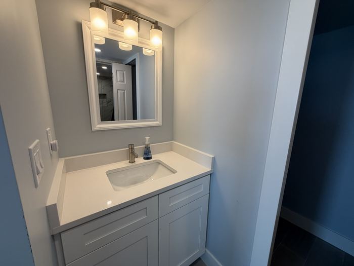 Primary bath vanity with quartz top and new cabinetry