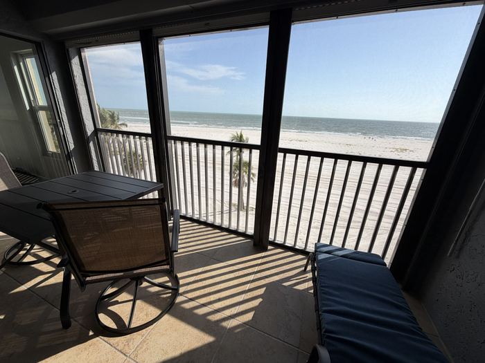 Chaise lounge on the lanai facing the Gulf of Mexico